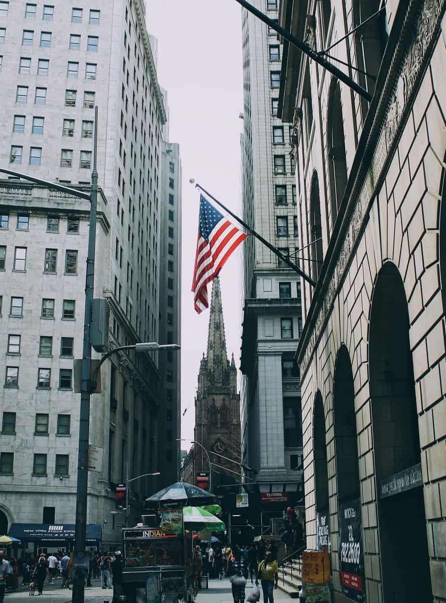 US flag beside street