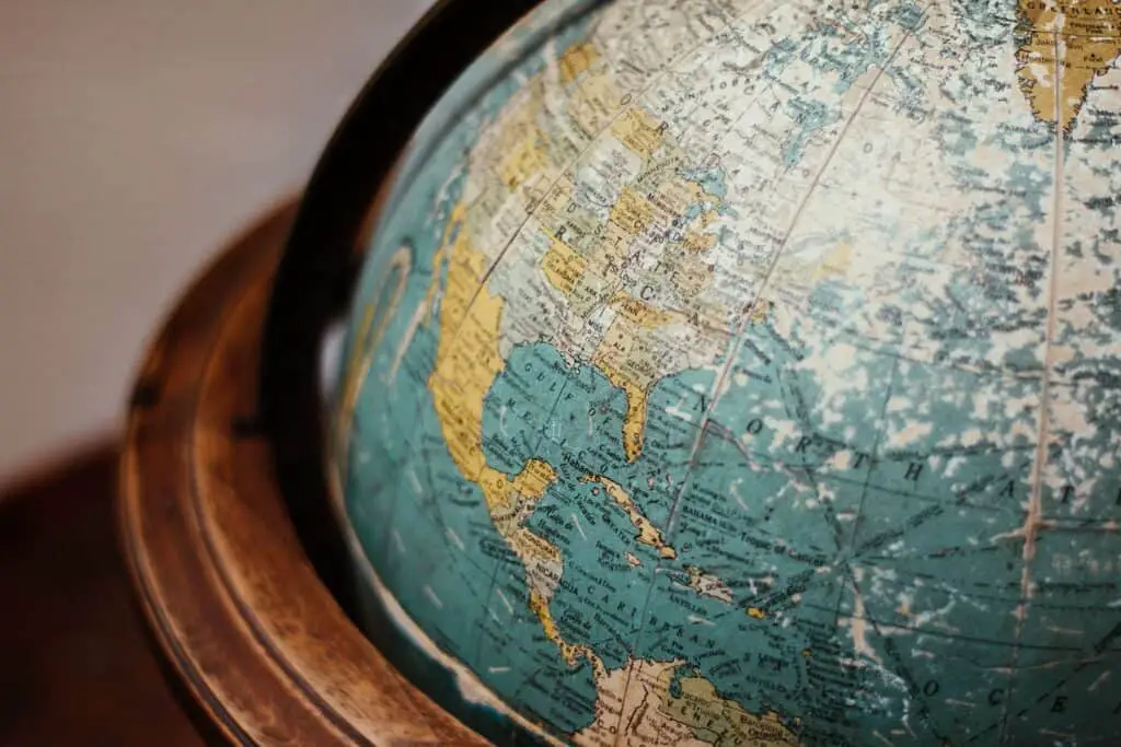 blue earth globe on table