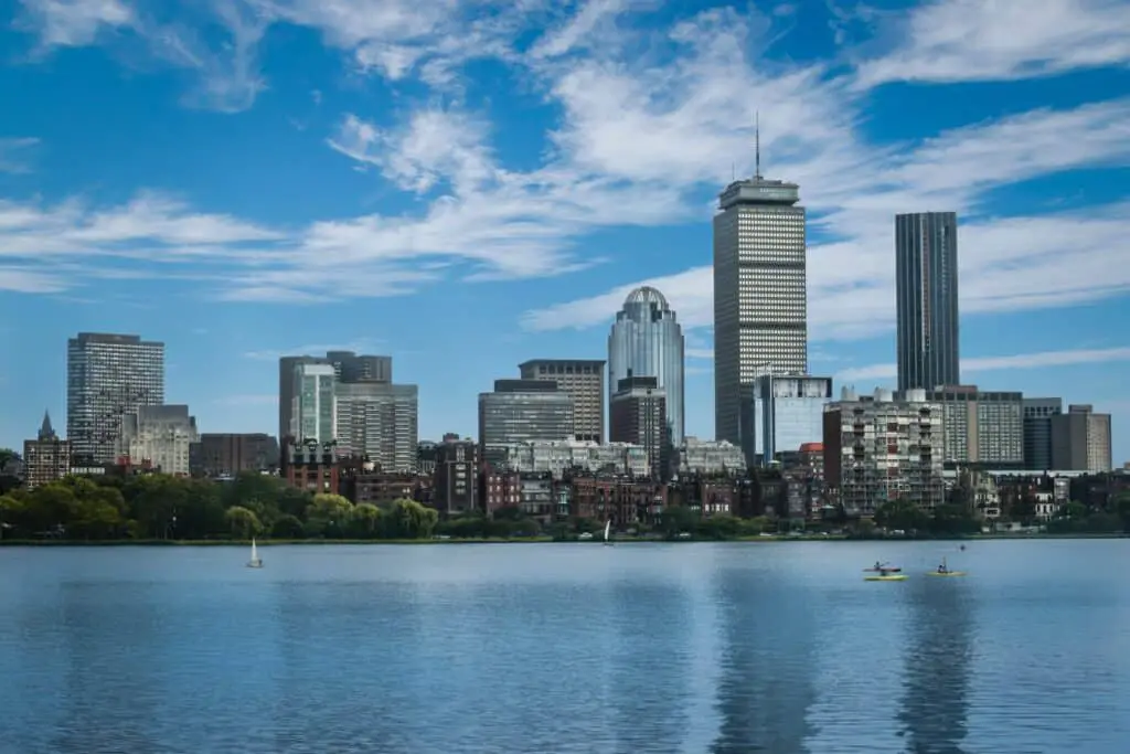 high-rise buildings under blue sky and white clouds