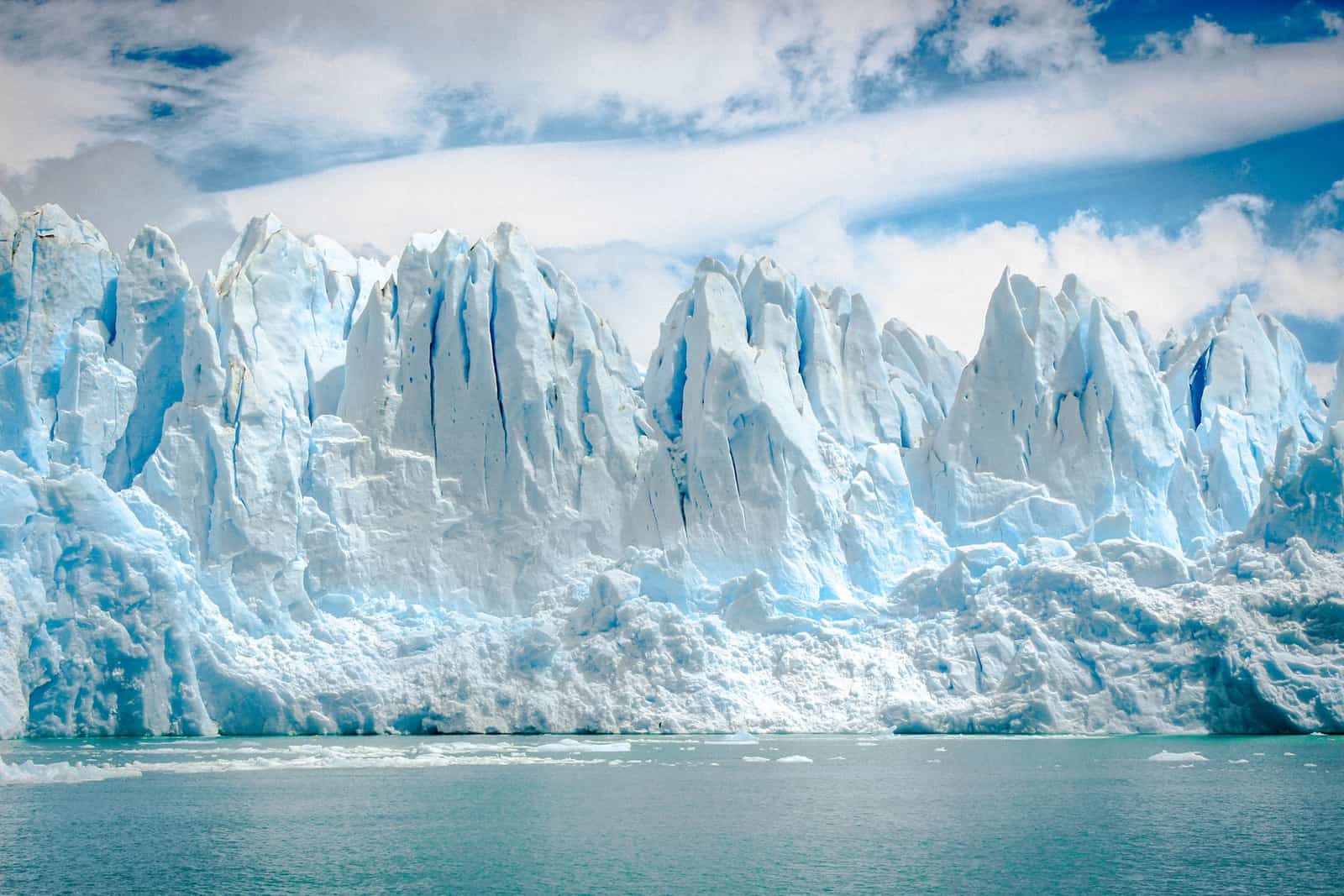 iceberg near body of water