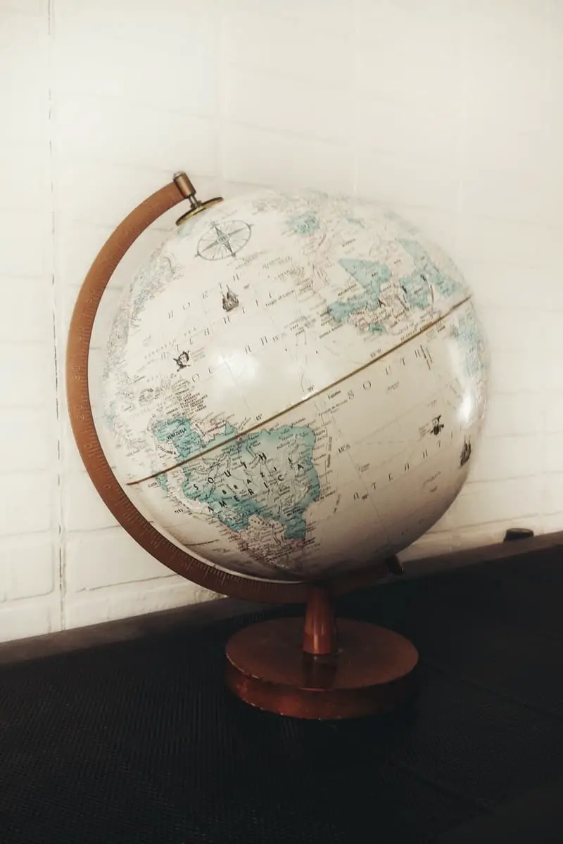 white and brown desk globe