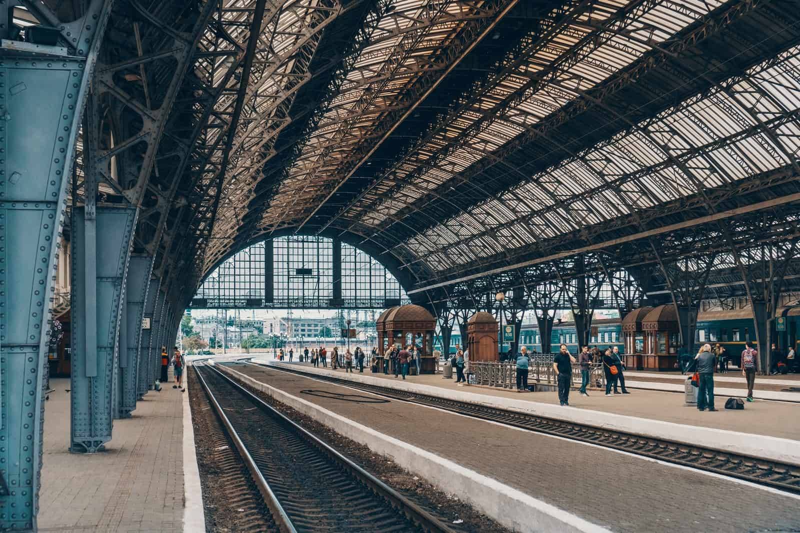 people standing inside gray station during daytime