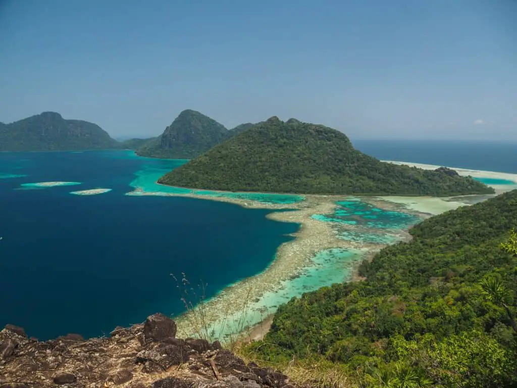 green sea surrounded with mountains