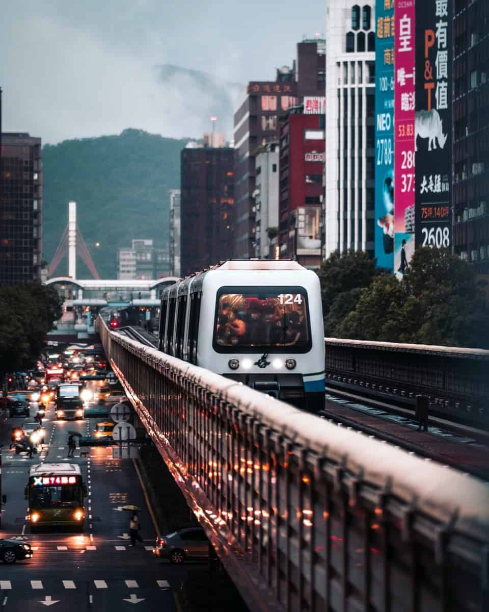 white and blue bus on road during daytime