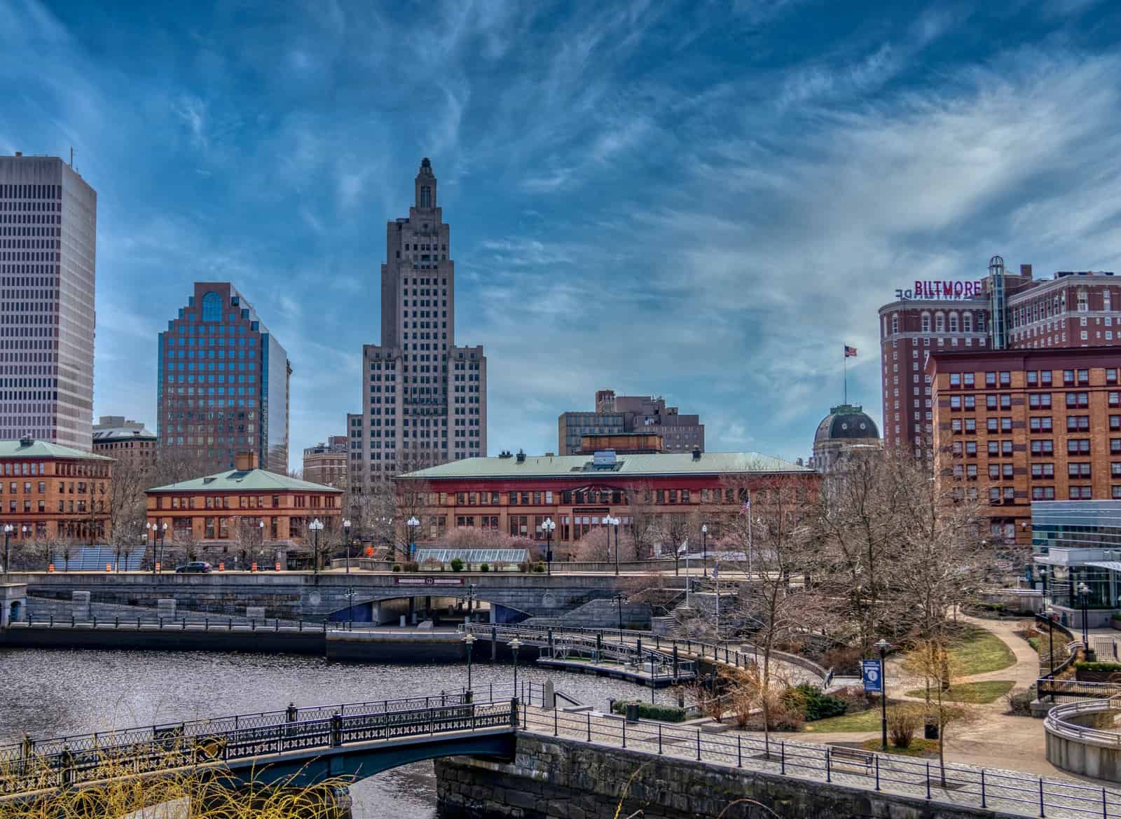 city skyline under blue sky and white clouds during daytime