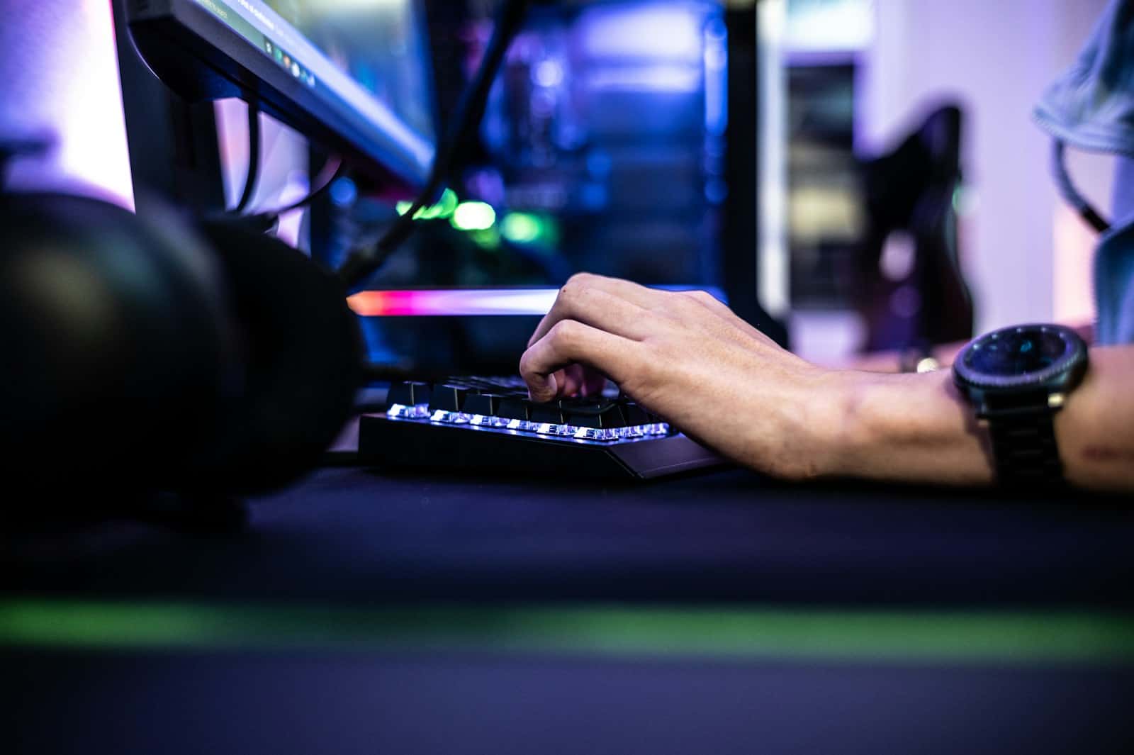 a person is typing on a laptop computer