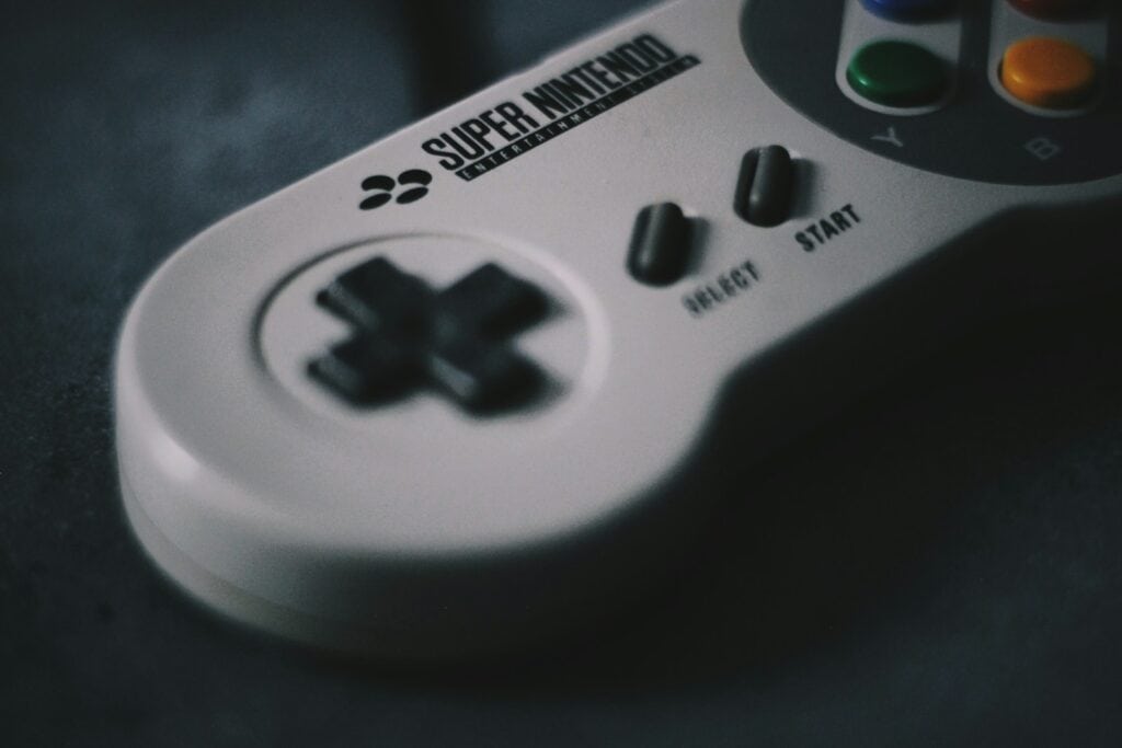 selective focus photography of SNES controller