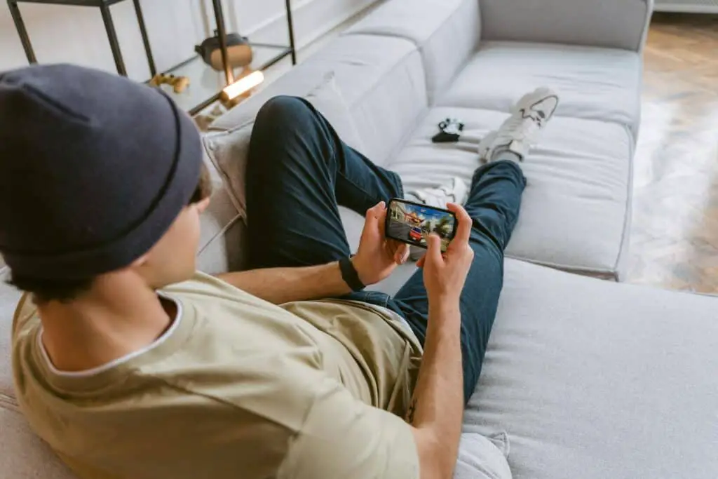 A Man Playing Mobile Game