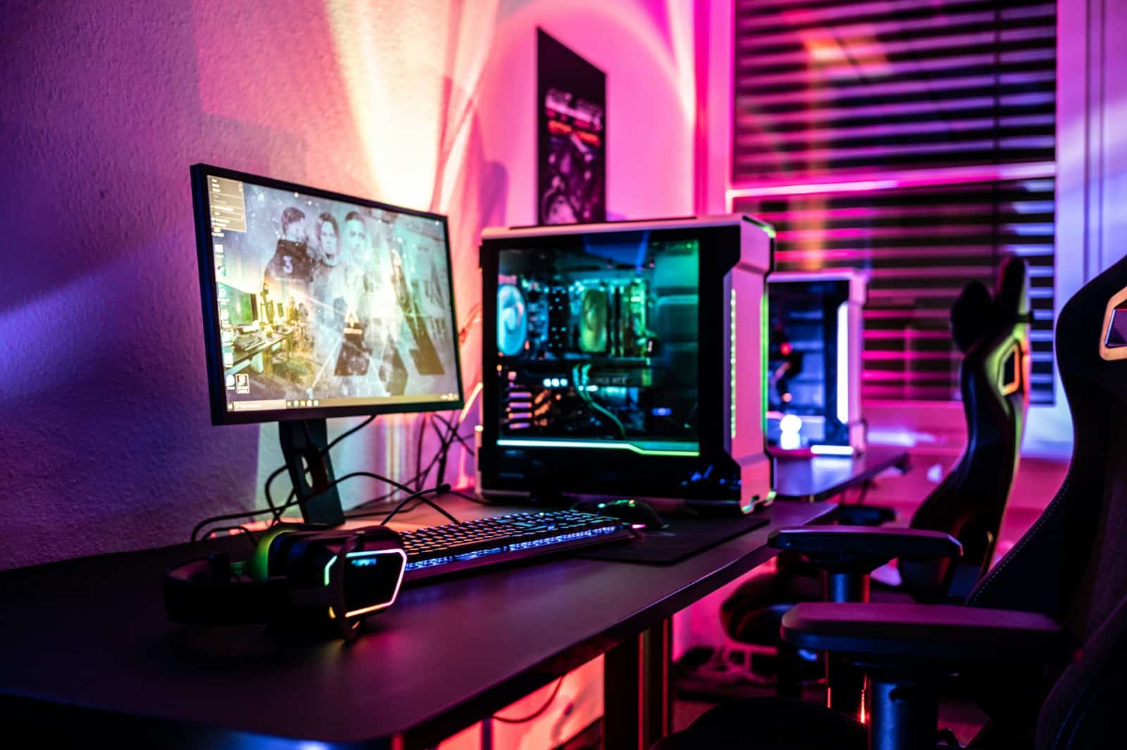 a desk with a laptop and a computer monitor