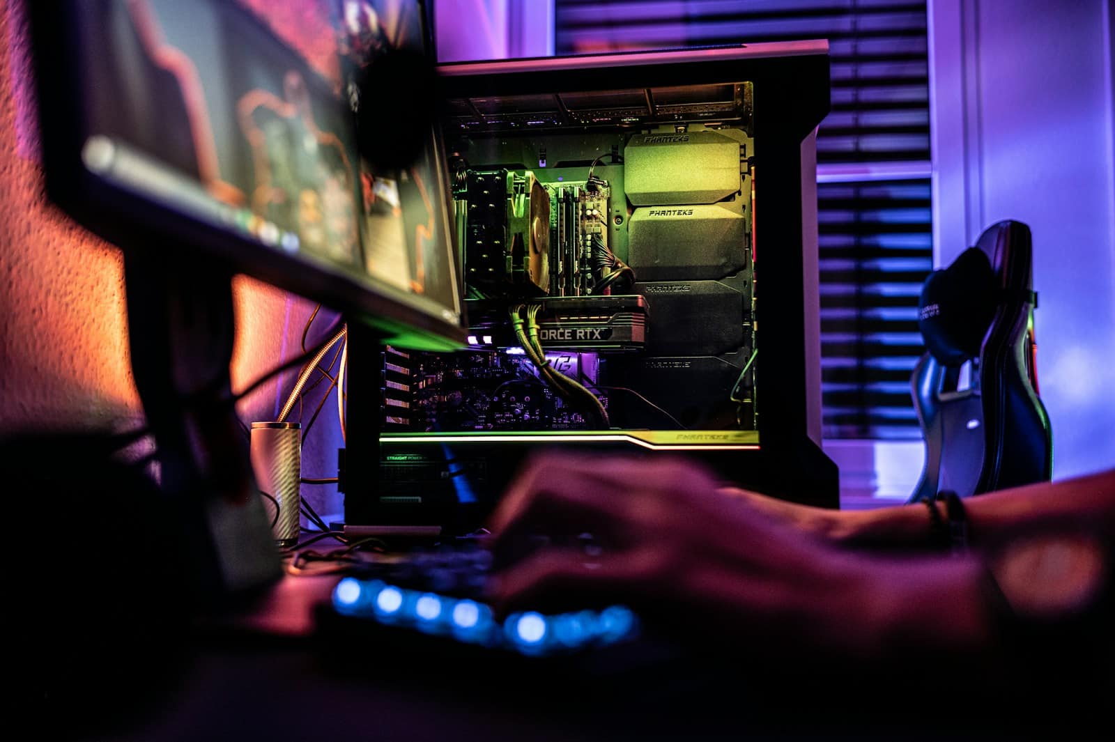 a person working on a computer in a dark room