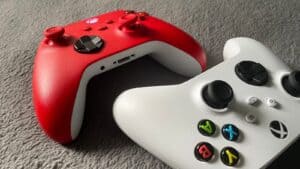 white and red xbox one game controller