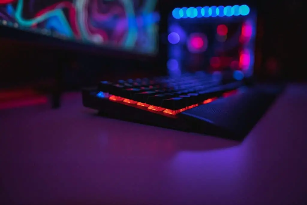 black computer keyboard on brown wooden table